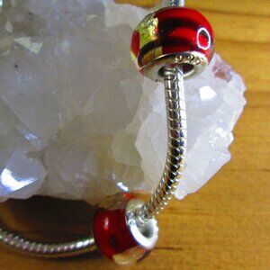 2 Murano Glass European charms with Foil inserts.